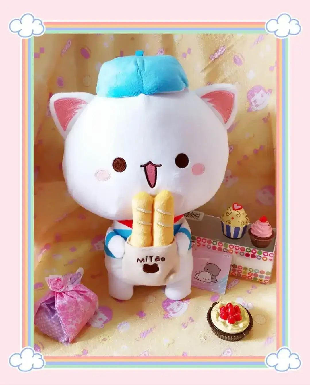 Peach and Goma Cat Plushies.