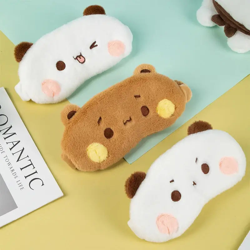 Cute Bubu and Dudu plush eye covers in white and brown, ideal for cozy sleep and relaxation.