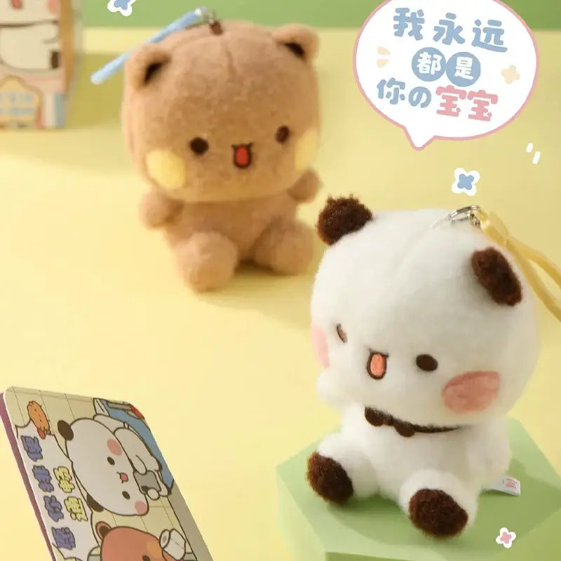 Bubu and Dudu plush figures in beige and white, showcasing their cute and collectible design.