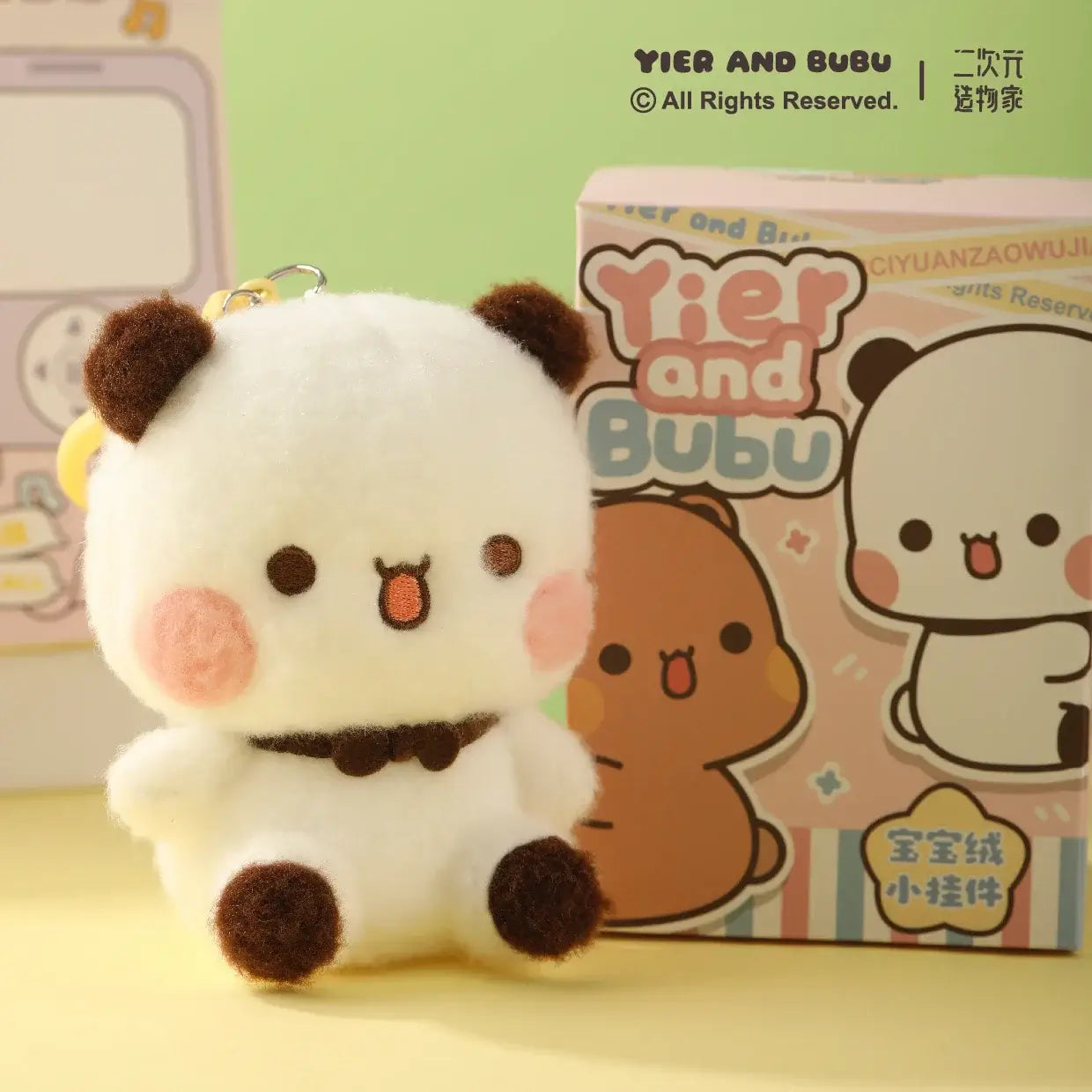 Adorable Bubu plush figure with keychain, showcasing its cute design and colorful packaging.